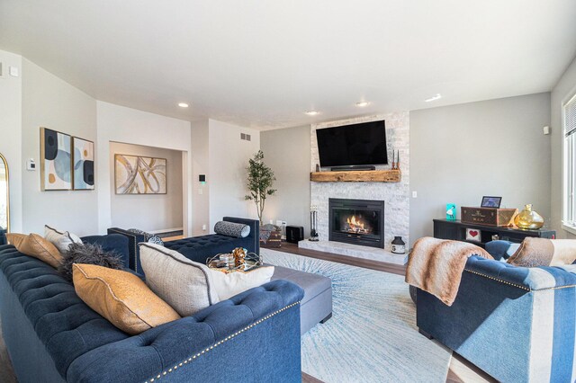 9037 Yorkshire Dr, Saline, MI 48176 - living room with visible vents, wood finished floors, a fireplace, and recessed lighting