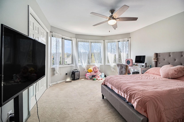 9037 Yorkshire Dr, Saline, MI 48176 - carpeted bedroom featuring baseboards, ceiling fan, and multiple windows