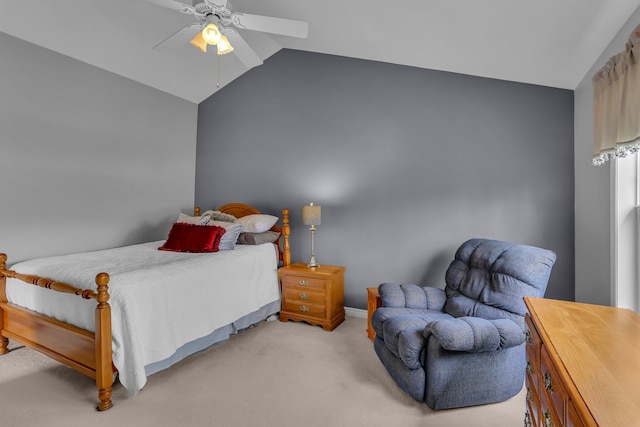 bedroom featuring ceiling fan, vaulted ceiling, and light carpet