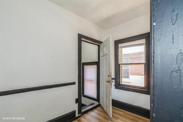 foyer with wood finished floors