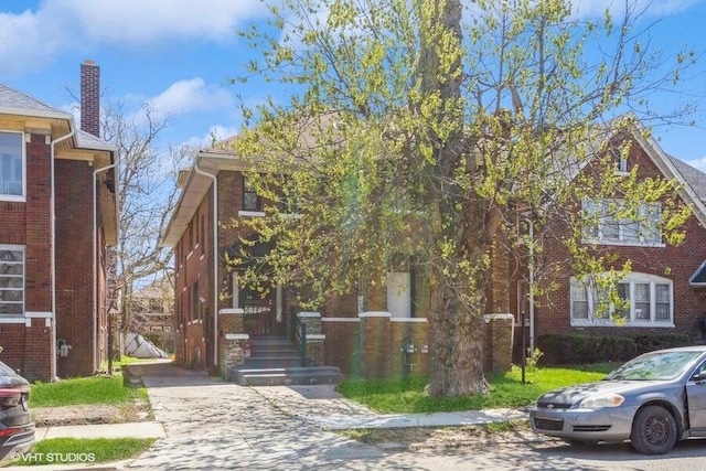 view of front of property featuring brick siding
