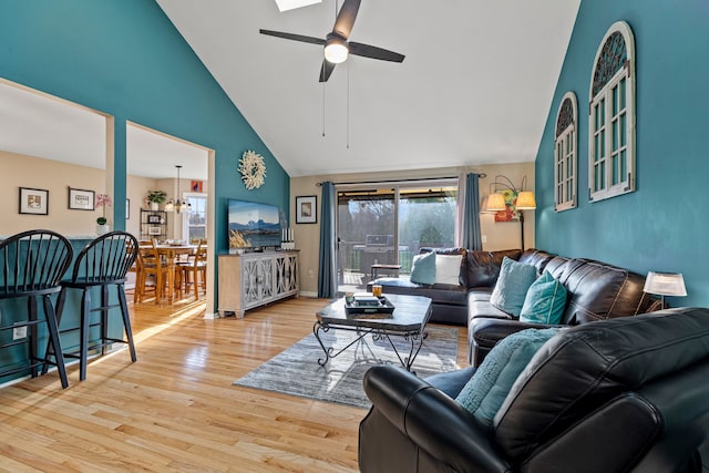 6240 Northridge Hills Dr, Brighton, MI 48116 - living area with high vaulted ceiling, wood finished floors, and ceiling fan