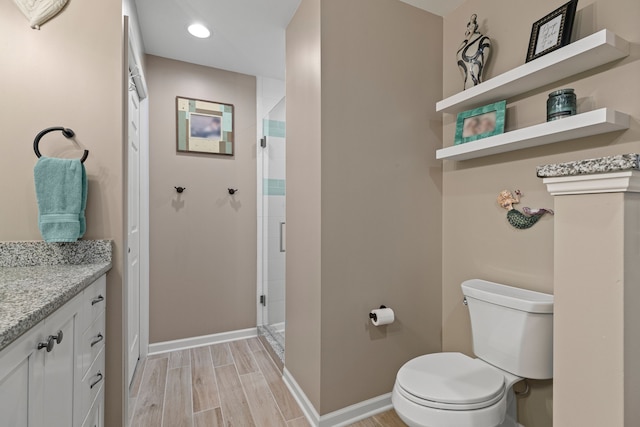 6240 Northridge Hills Dr, Brighton, MI 48116 - bathroom with toilet, a shower stall, vanity, baseboards, and recessed lighting