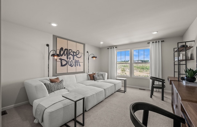 living room with baseboards, carpet, and recessed lighting
