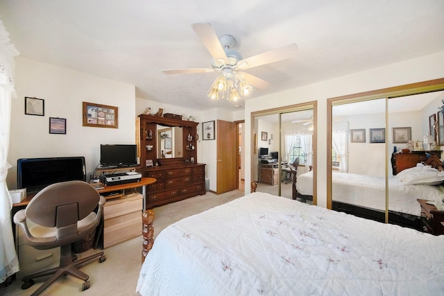 10500 Woodland Dr, Jerome, MI 49249 - bedroom with multiple closets, light colored carpet, and a ceiling fan