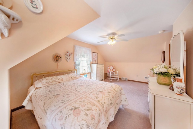 10500 Woodland Dr, Jerome, MI 49249 - bedroom with vaulted ceiling, baseboards, visible vents, light colored carpet, and a ceiling fan