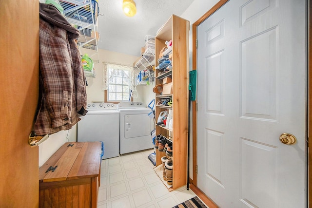 10500 Woodland Dr, Jerome, MI 49249 - washroom featuring washer and clothes dryer, tile patterned floors, and laundry area