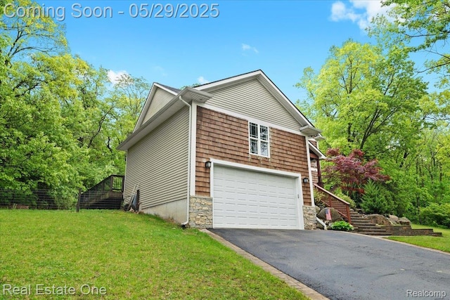 9327 Van Antwerp Rd, Brighton, MI 48116 - view of property exterior with stairway, driveway, a lawn, stone siding, and a garage