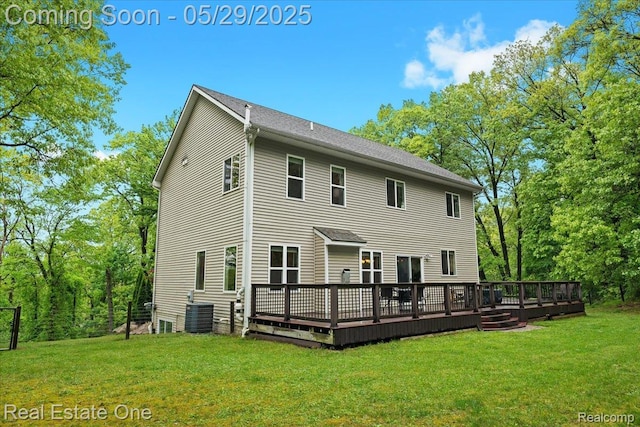 9327 Van Antwerp Rd, Brighton, MI 48116 - rear view of property with a wooden deck, a yard, and cooling unit