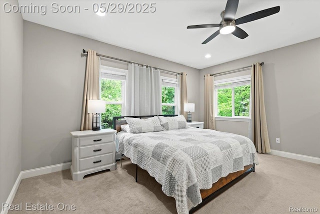 9327 Van Antwerp Rd, Brighton, MI 48116 - bedroom with light colored carpet, baseboards, and ceiling fan