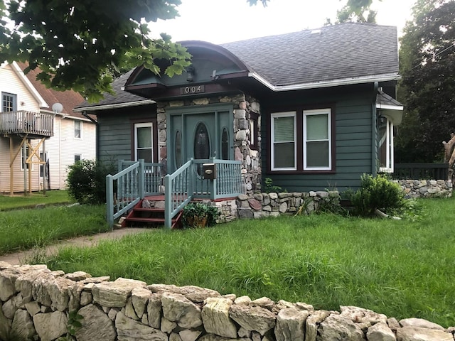 bungalow-style house with a shingled roof