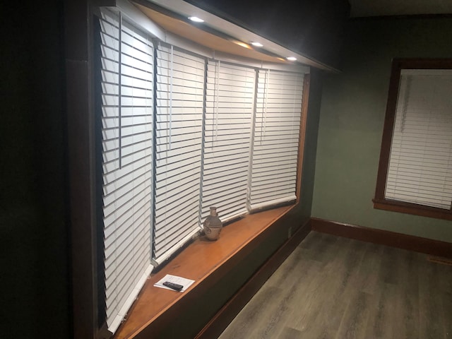 room details with baseboards, wood finished floors, and recessed lighting