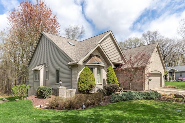 70 Chestnut Ct, Chelsea, MI 48118 - view of front of home with a front yard, a shingled roof, and brick siding