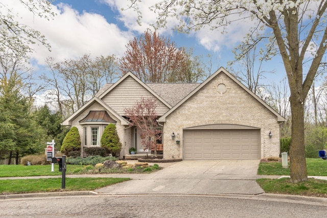 70 Chestnut Ct, Chelsea, MI 48118 - view of front of property featuring a front lawn, a garage, brick siding, roof with shingles, and concrete driveway