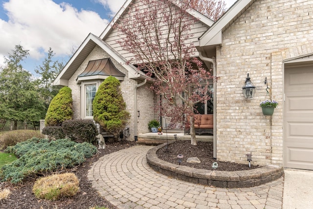 70 Chestnut Ct, Chelsea, MI 48118 - entrance to property featuring brick siding