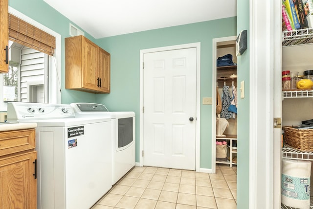 70 Chestnut Ct, Chelsea, MI 48118 - washroom featuring light tile patterned floors, washer and dryer, and cabinet space
