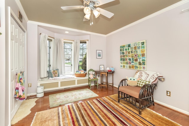 70 Chestnut Ct, Chelsea, MI 48118 - sitting room with crown molding, a ceiling fan, wood finished floors, and baseboards