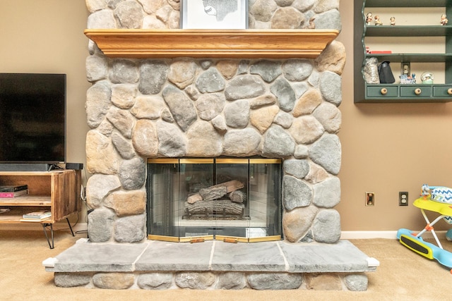 70 Chestnut Ct, Chelsea, MI 48118 - room details with baseboards, carpet floors, and a fireplace