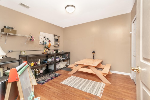 70 Chestnut Ct, Chelsea, MI 48118 - interior space featuring visible vents, wood finished floors, and baseboards