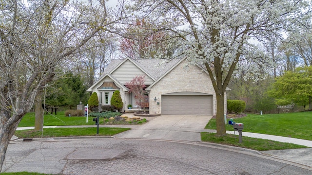 70 Chestnut Ct, Chelsea, MI 48118 - view of front of house with brick siding, roof with shingles, a front lawn, concrete driveway, and an attached garage