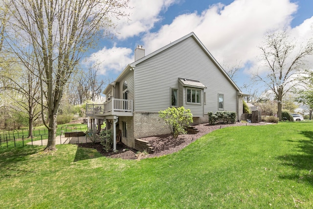 70 Chestnut Ct, Chelsea, MI 48118 - view of property exterior with a deck, a chimney, and a yard