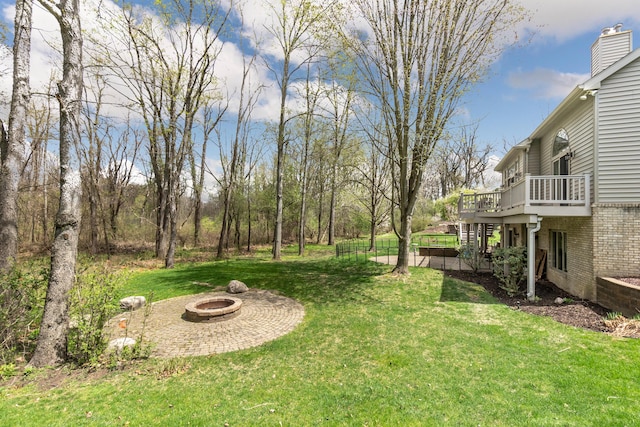 70 Chestnut Ct, Chelsea, MI 48118 - view of yard featuring an outdoor fire pit, stairs, and a wooden deck