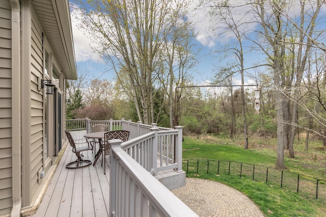 70 Chestnut Ct, Chelsea, MI 48118 - deck with outdoor dining area and a yard
