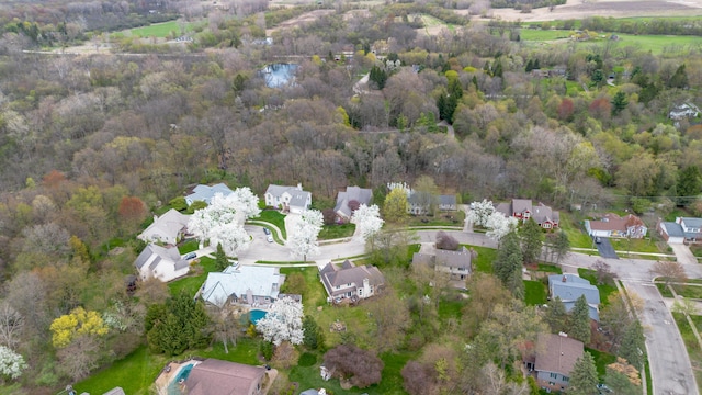 70 Chestnut Ct, Chelsea, MI 48118 - bird's eye view with a residential view and a view of trees