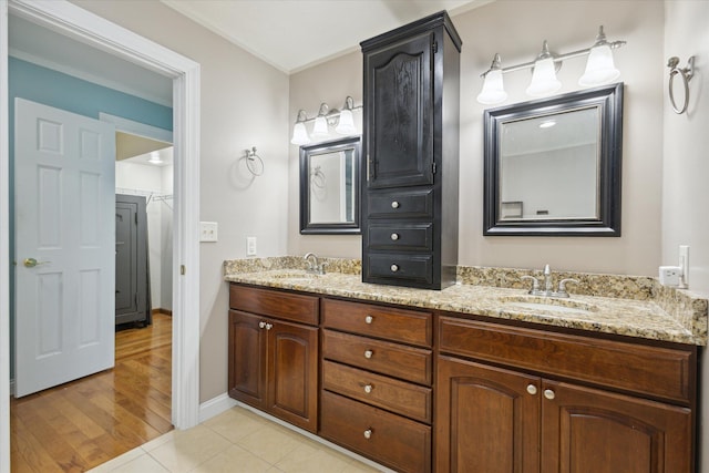 6030 Paw Paw Lake Rd, Coloma, MI 49038 - full bath featuring double vanity, tile patterned flooring, and baseboards