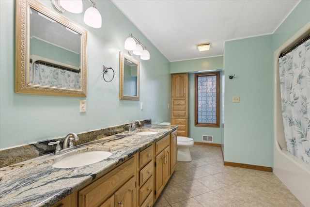 6030 Paw Paw Lake Rd, Coloma, MI 49038 - full bathroom with double vanity, toilet, baseboards, tile patterned flooring, and shower / bath combination with curtain
