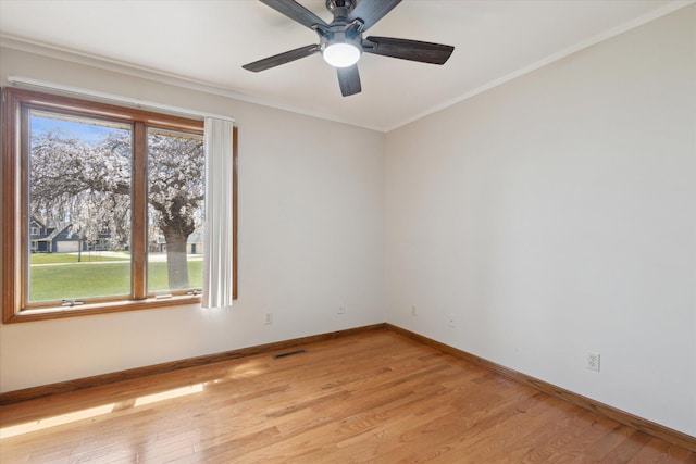 6030 Paw Paw Lake Rd, Coloma, MI 49038 - empty room featuring healthy amount of natural light, light wood-style flooring, baseboards, and ornamental molding