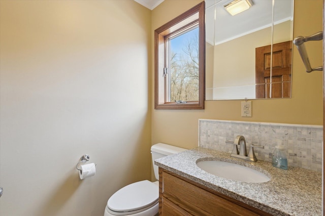 6030 Paw Paw Lake Rd, Coloma, MI 49038 - half bath with decorative backsplash, toilet, vanity, and crown molding