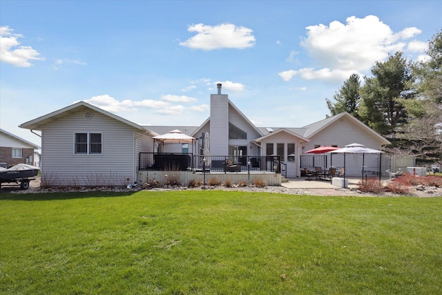 6030 Paw Paw Lake Rd, Coloma, MI 49038 - back of house with a gazebo, a patio area, and a chimney