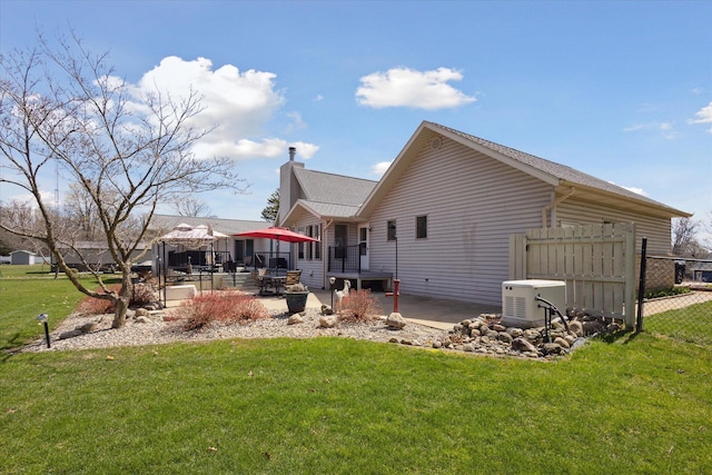 6030 Paw Paw Lake Rd, Coloma, MI 49038 - rear view of property with a patio and a chimney