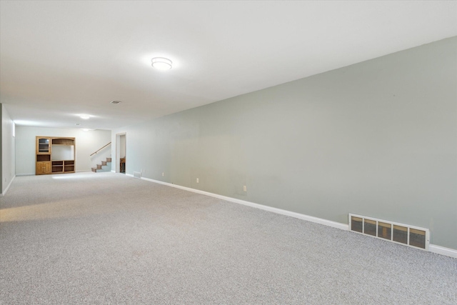 6030 Paw Paw Lake Rd, Coloma, MI 49038 - empty room featuring carpet floors, stairway, and baseboards