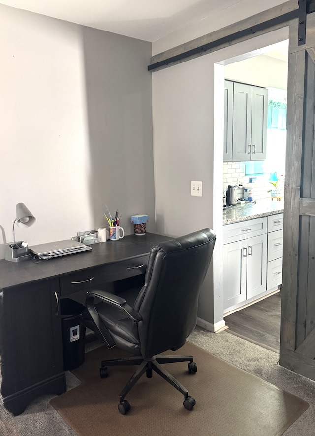 office area with a barn door