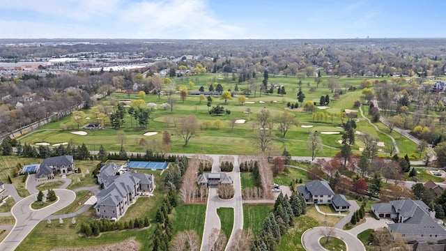drone / aerial view featuring a residential view and view of golf course