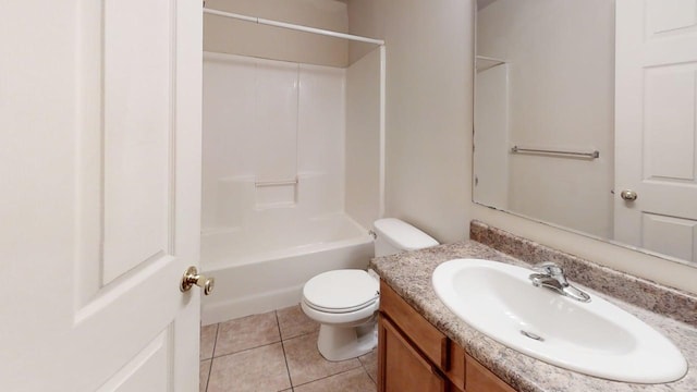 bathroom featuring toilet, vanity, tile patterned floors, and shower / tub combination