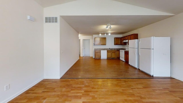 kitchen featuring light wood-style flooring, white appliances, track lighting, light countertops, and visible vents
