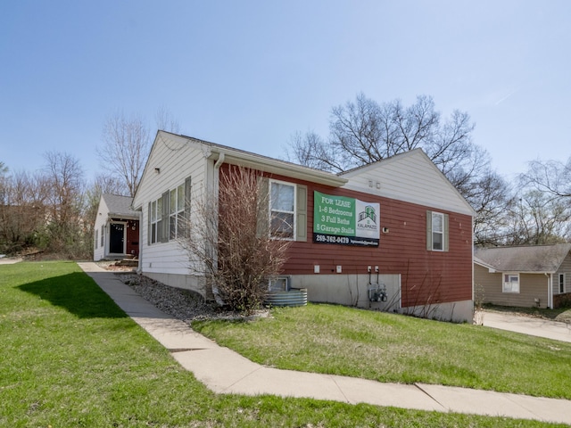 view of property exterior with a lawn