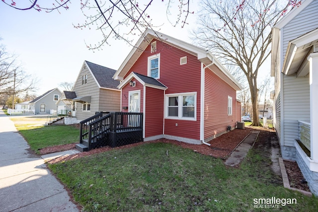 bungalow-style home with a front yard
