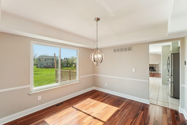 4658 White Pine Ct, Ypsilanti, MI 48197 - empty room with wood-type flooring, baseboards, and visible vents
