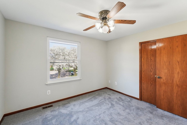 4658 White Pine Ct, Ypsilanti, MI 48197 - spare room featuring ceiling fan, carpet floors, visible vents, and baseboards