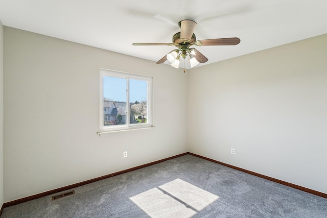 4658 White Pine Ct, Ypsilanti, MI 48197 - carpeted empty room with baseboards, a ceiling fan, and visible vents