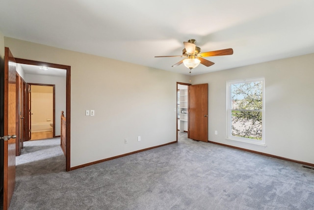 4658 White Pine Ct, Ypsilanti, MI 48197 - carpeted spare room with visible vents, baseboards, and ceiling fan
