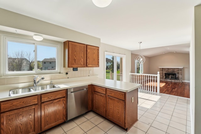 4658 White Pine Ct, Ypsilanti, MI 48197 - kitchen with dishwasher, a peninsula, a sink, and light tile patterned floors