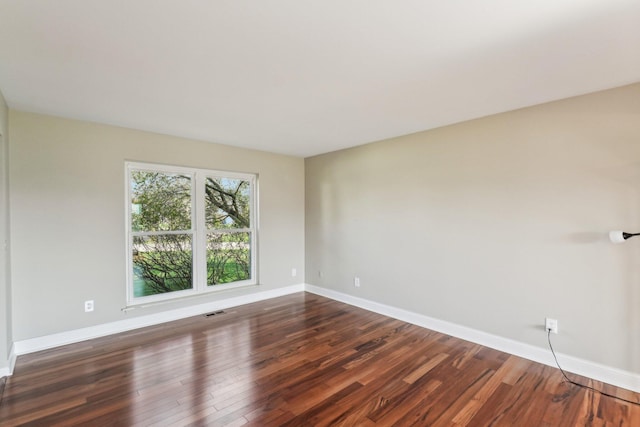 4658 White Pine Ct, Ypsilanti, MI 48197 - spare room featuring dark wood finished floors, baseboards, and visible vents