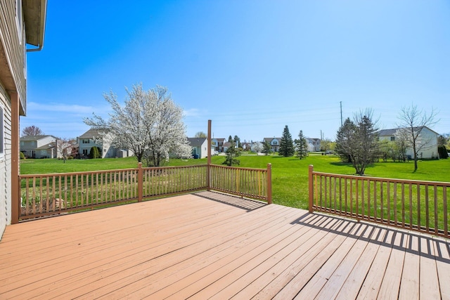 4658 White Pine Ct, Ypsilanti, MI 48197 - wooden deck featuring a lawn and a residential view