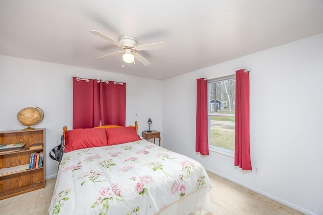 bedroom with baseboards, a ceiling fan, and carpet flooring