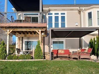 935 Stony Lake Ct, Oxford, MI 48371 - rear view of house with a yard and outdoor lounge area